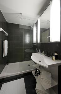 חדר רחצה ב-Aparthotel Adagio Vienna City