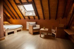 A bed or beds in a room at La Ferme De Noémie