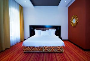 Giường trong phòng chung tại Nane Hotel