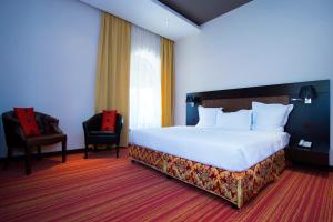 Giường trong phòng chung tại Nane Hotel