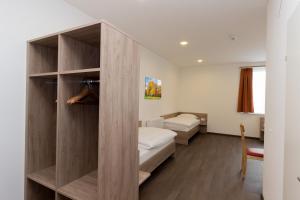 Cama ou camas em um quarto em WinBudget "bed&breakfast" Guntramsdorf