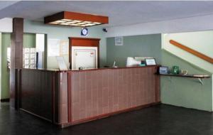 an office with a reception desk in a room at Hotel Atlantico Sul in Caraguatatuba