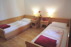 A bed or beds in a room at Albergo Casagrande