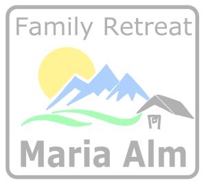 un logo per un rifugio familiare nella locanda marina di Family Retreat Maria Alm a Maria Alm am Steinernen Meer