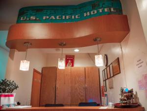 a room with a us pacific hotel sign on the wall at U.S. Pacific Hotel in New York