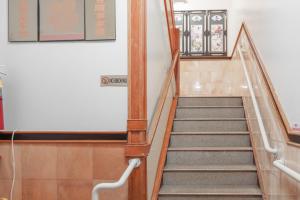 a staircase in a building with a sign on it at U.S. Pacific Hotel in New York