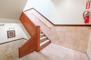 a staircase in a home with wood and tile floors at U.S. Pacific Hotel in New York