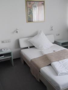 Postelja oz. postelje v sobi nastanitve Businesshotel & Appartements Stuttgart-Vaihingen