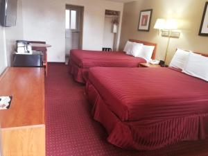 Кровать или кровати в номере Americas Best Value Inn-Williams/Grand Canyon