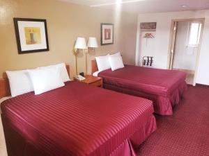 Кровать или кровати в номере Americas Best Value Inn-Williams/Grand Canyon