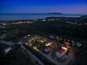 an aerial view of a resort at night at Kotroni Villas in Finikounta