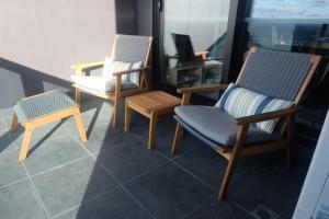 Area tempat duduk di Whitehorse Towers Self Service Holiday Apartment