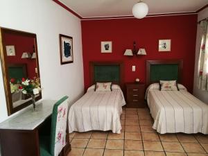 Una cama o camas en una habitación de Hostal Maestre