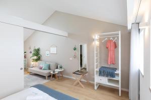 Una cama o camas en una habitación de Feel Nazaré - Boutique Apartments