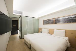 Vuode tai vuoteita majoituspaikassa Sotetsu Hotels The Splaisir Seoul Myeongdong