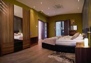 Uma cama ou camas num quarto em Hotel Forum Fitness Spa & Wellness