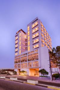 a tall white building with lights on it at Jetwing Jaffna in Jaffna