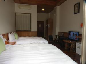 Seasons Inn में एक कमरे में एक या कई बेड