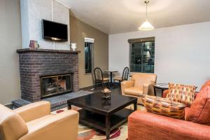 a living room with a couch and a fireplace at Super 8 by Wyndham Boise in Boise