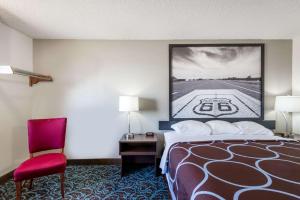 A bed or beds in a room at Super 8 by Wyndham Tucumcari