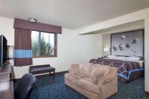 A bed or beds in a room at Super 8 by Wyndham Tucumcari