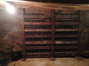 a wine cellar with a bunch of wine bottles at Once upon a time in Koprivshtitsa