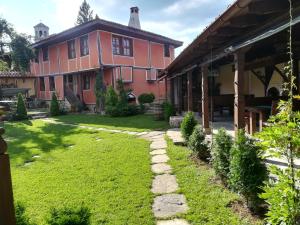 a house with a garden in front of it at Once upon a time in Koprivshtitsa