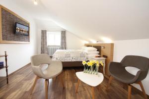 Giường trong phòng chung tại Altstadt-Hotel Passau