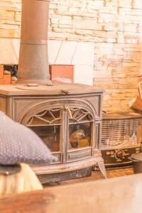 an old wood stove sitting in a room at Nikko Park Lodge Mountain Side in Nikko