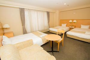 Hotel Yokohama Camelot Japan房間的床