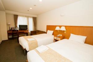 Hotel Yokohama Camelot Japan房間的床