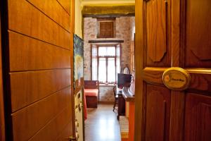 a hallway of a house with a door and a room at Archontiko Hatzipanayioti in Leonidion