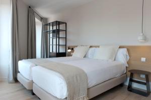 MH Apartments Central Madrid में एक कमरे में एक या कई बेड