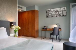 Кровать или кровати в номере Focus Hotel Poznań