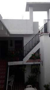 a staircase in a house with flowers on it at Hotel De Cortez y Larraz in Antigua Guatemala