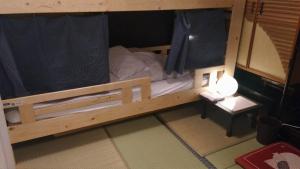 Кровать или кровати в номере Guest House Kuranomachi ゲストハウス蔵の街