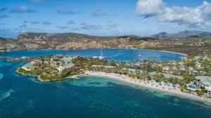 an aerial view of an island in the ocean at St. James's Club Resort - All Inclusive in English Harbour Town