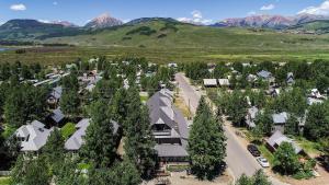 an aerial view of a house with trees and mountains at Elk Mountain Lodge in Crested Butte