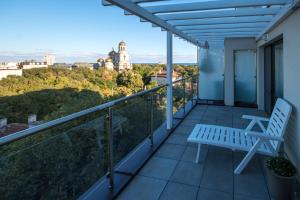 En balkon eller terrasse på City Apartments Triumph