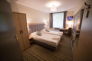 Кровать или кровати в номере Hotel Ossowski