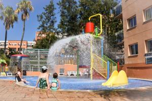 a group of people playing in a water park at Aparthotel SunClub Salou in Salou