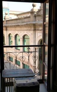 a view of a building from a balcony at Apartamentos Plaza Mayor in Gijón