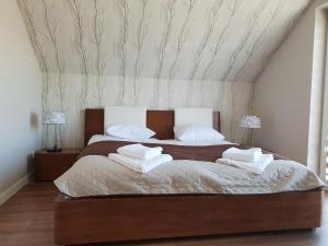 Ліжко або ліжка в номері Hotel Pod Strzechą