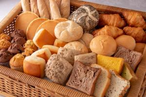 a basket of different types of bread and pastries at Tokushima Grandvrio Hotel in Tokushima