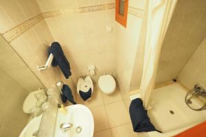 a bathroom with a sink and a toilet and a shower at Hotel Montserrat in Sitges