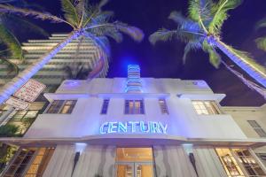 a scientology building with palm trees in front of it at Century Hotel in Miami Beach