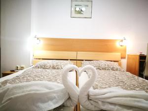 Ліжко або ліжка в номері Rooms Aračić