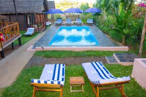 Piscina a Bungalows des tropiques o a prop