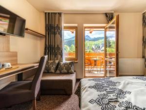 Uma área de estar em Hotel Zakopane Wellness & SPA ex Korona Tatr