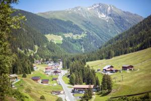 a small village in a valley with a mountain at Gasthof Burkert in Oetz